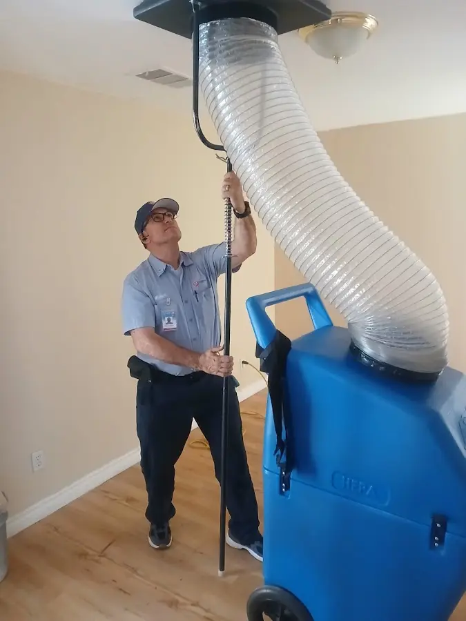 Furnace Tune-Up technician using HEPA equipment in Andalusia